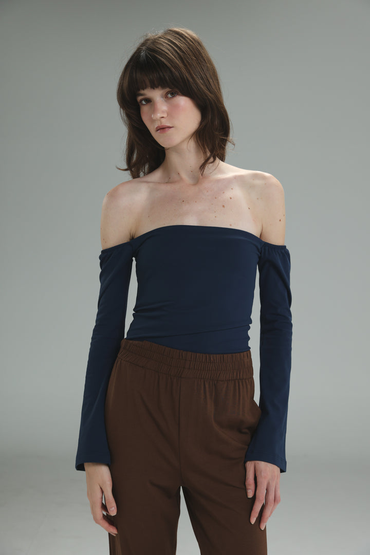 A navy lycra off the shoulder top with long sleeves and a fitted stretchy design shown from the front