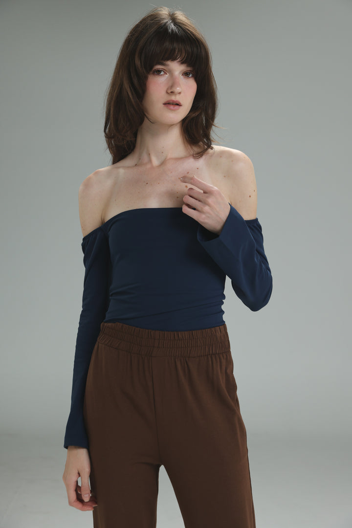 Navy off shoulder top with long sleeves, fitted bodice, and elasticated waistband, front view