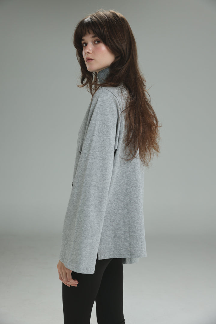 Joy grey polo soft heather gray long-sleeved turtleneck top with relaxed fit and subtle texture shown from the front
