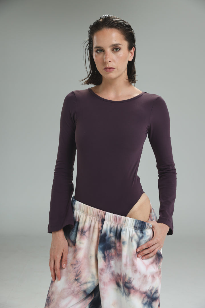 Lycra purple bodysuit with long sleeves, rounded neckline, side slit, and open back shown from the front view