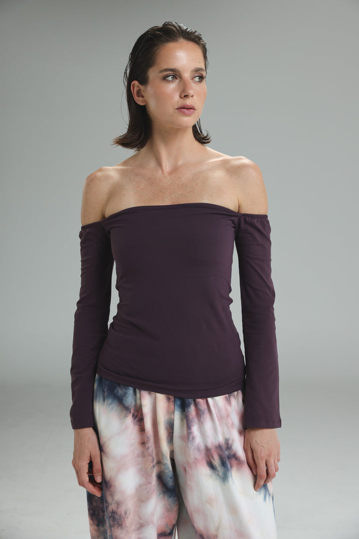 Lycra purple off shoulder top with long sleeves in deep plum shown from the front
