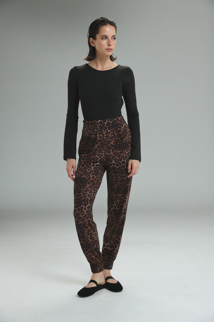 Black lycra open back bodysuit with long sleeves and a simple round neckline shown from the front