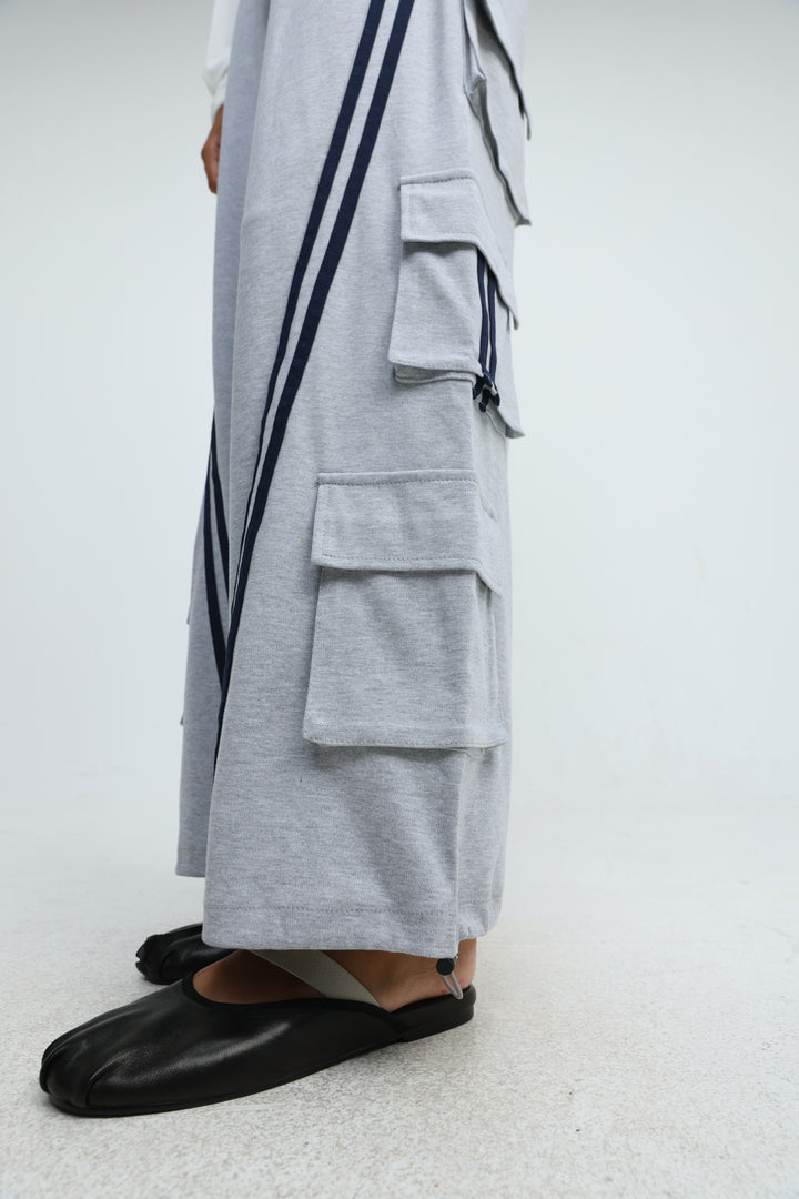 Port Grey joggers in light gray with navy blue vertical stripes and multiple front flap pockets visible from the side