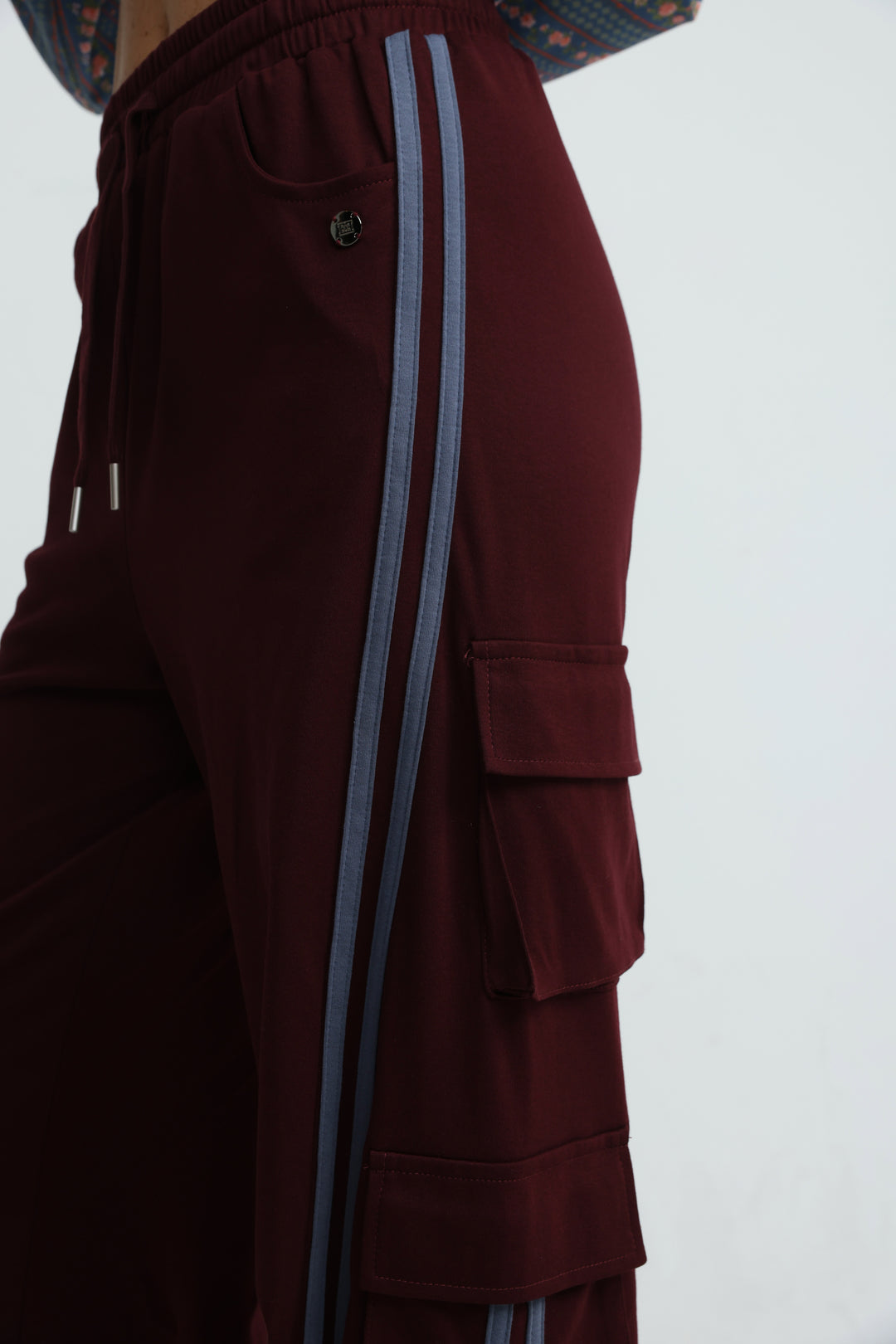 Port wine joggers maroon cargo pants with light blue vertical stripes and a front view drawstring waistband