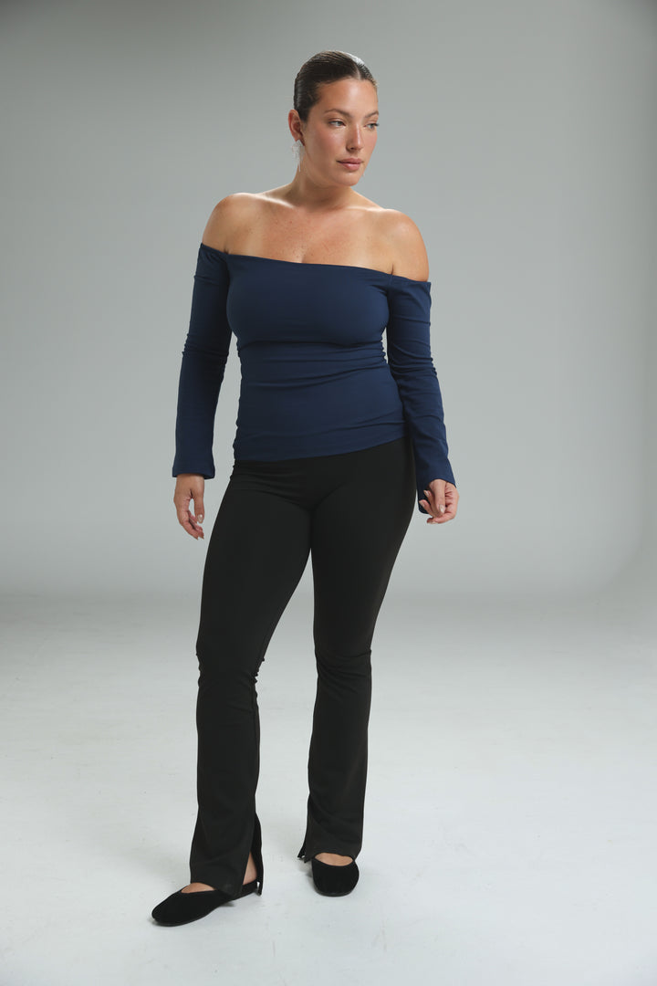 Lycra black off shoulder top with fitted silhouette and subtle ruching at the neckline shown from the front