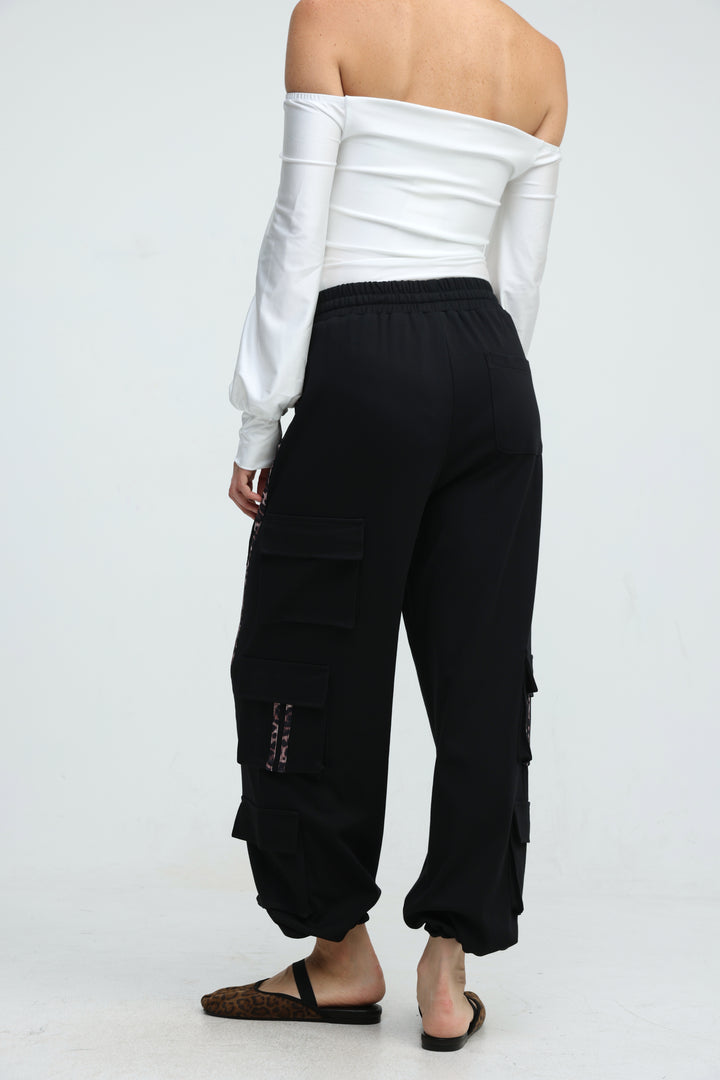 Black cargo joggers with multiple side pockets and elastic cuffs shown from the front view
