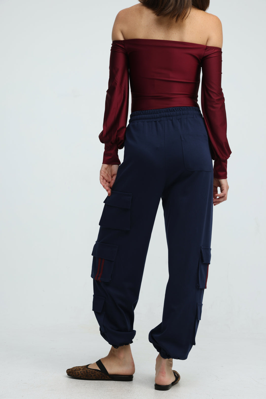 Navy blue cargo joggers with multiple pockets and elastic cuffs shown from the front