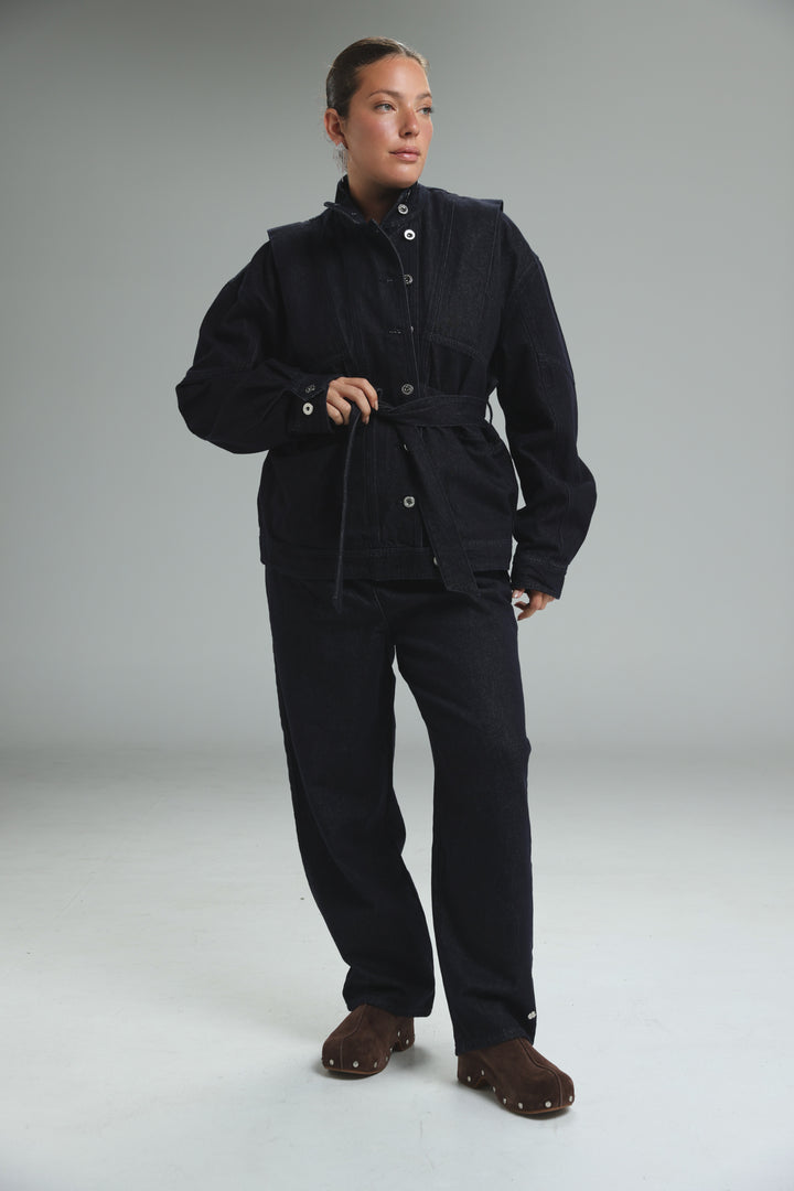 Prestige dark blue denim jacket with front button closures and belted waist shown from the front