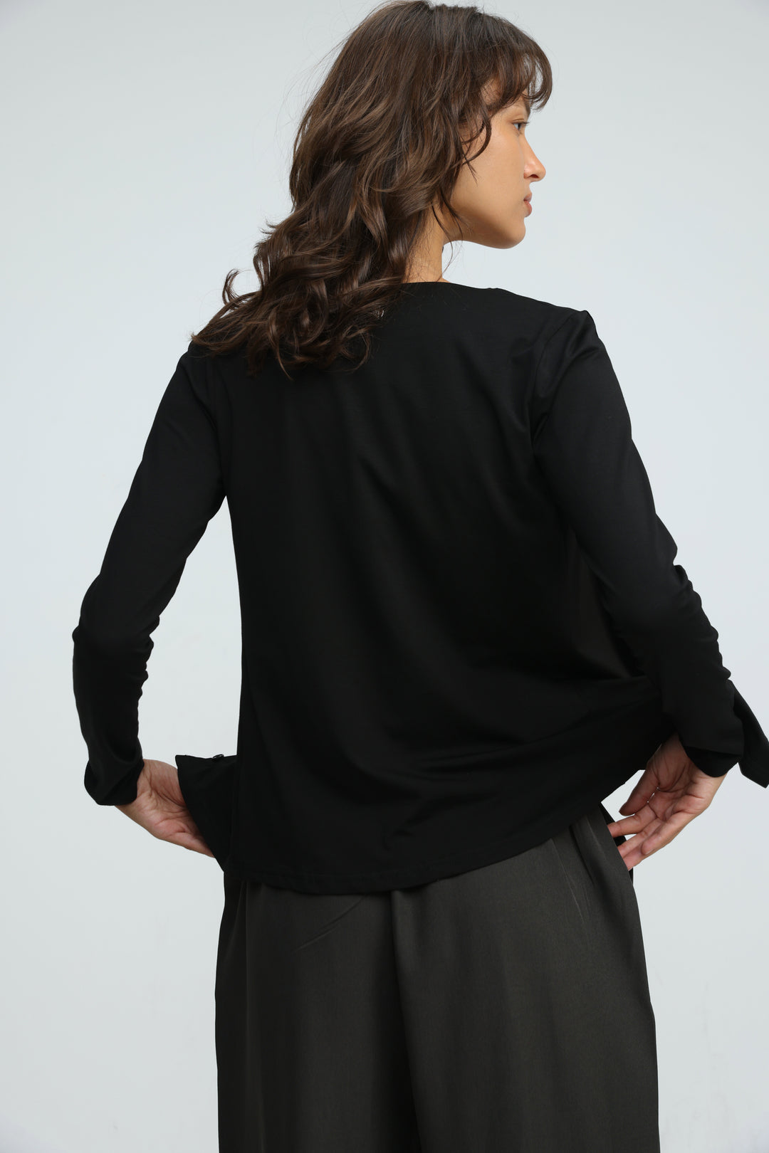 Black layered tank cardigan with long sleeves, relaxed fit, and subtle ruching at the shoulders, front view