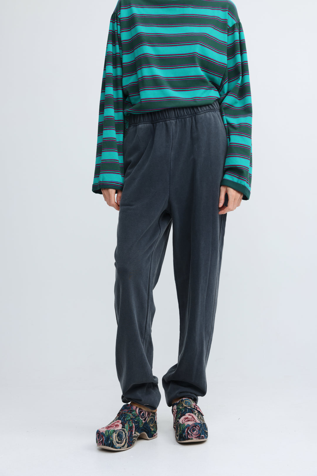 Zone dark blue joggers shown as dark gray loose-fitting sweatpants with elastic waistband, front view