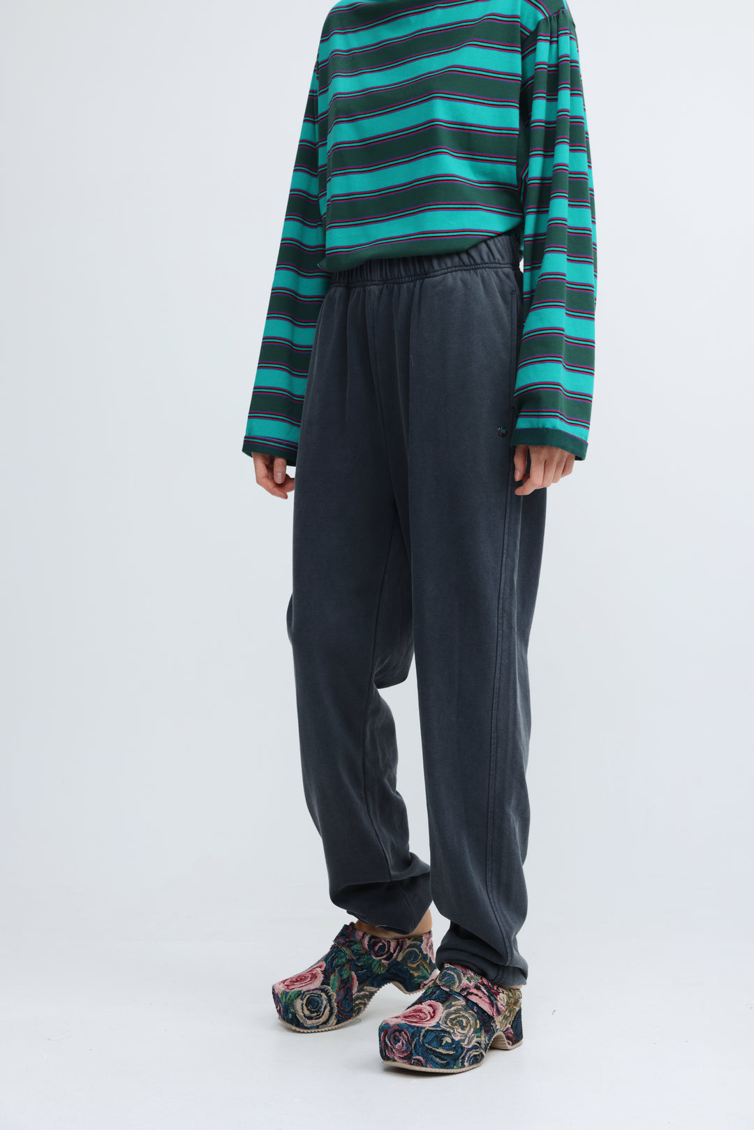 Dark blue joggers with a drawstring waist and subtle side seam detailing shown from the front