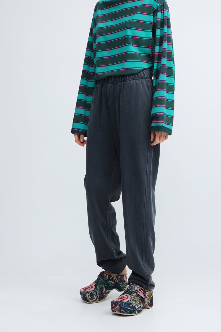 Dark blue joggers with a drawstring waist and subtle side seam detailing shown from the front
