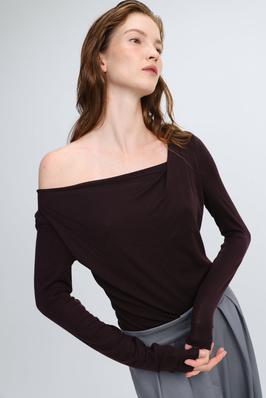 Miss purple shirt dark brown off-the-shoulder long-sleeved top with draped neckline and ribbed cuffs, front view