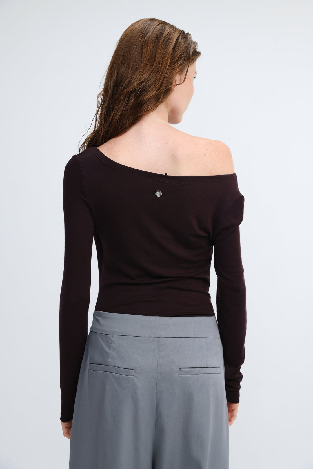 Miss purple shirt black off-the-shoulder long-sleeve top with subtle silver button at the neckline front view