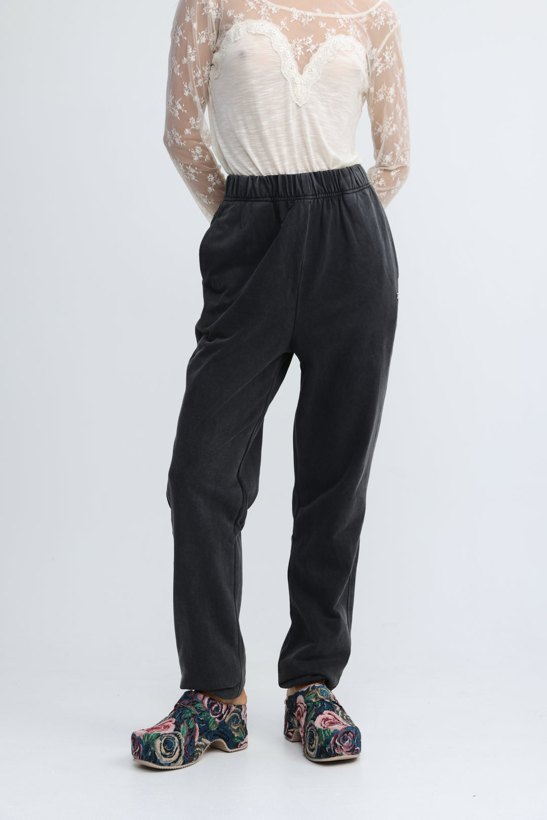 Black elastic-waist zone joggers with a relaxed straight-leg cut shown from the front