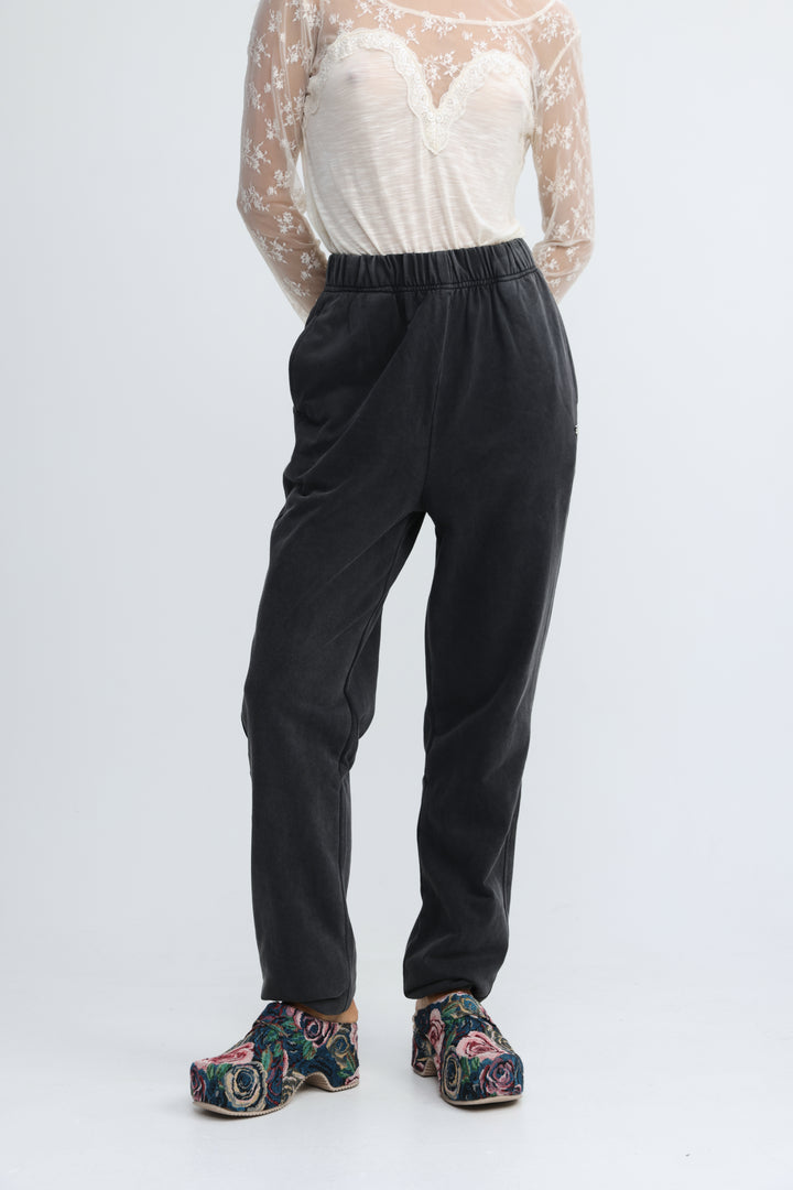 Black elastic-waist zone joggers with a relaxed straight-leg cut shown from the front