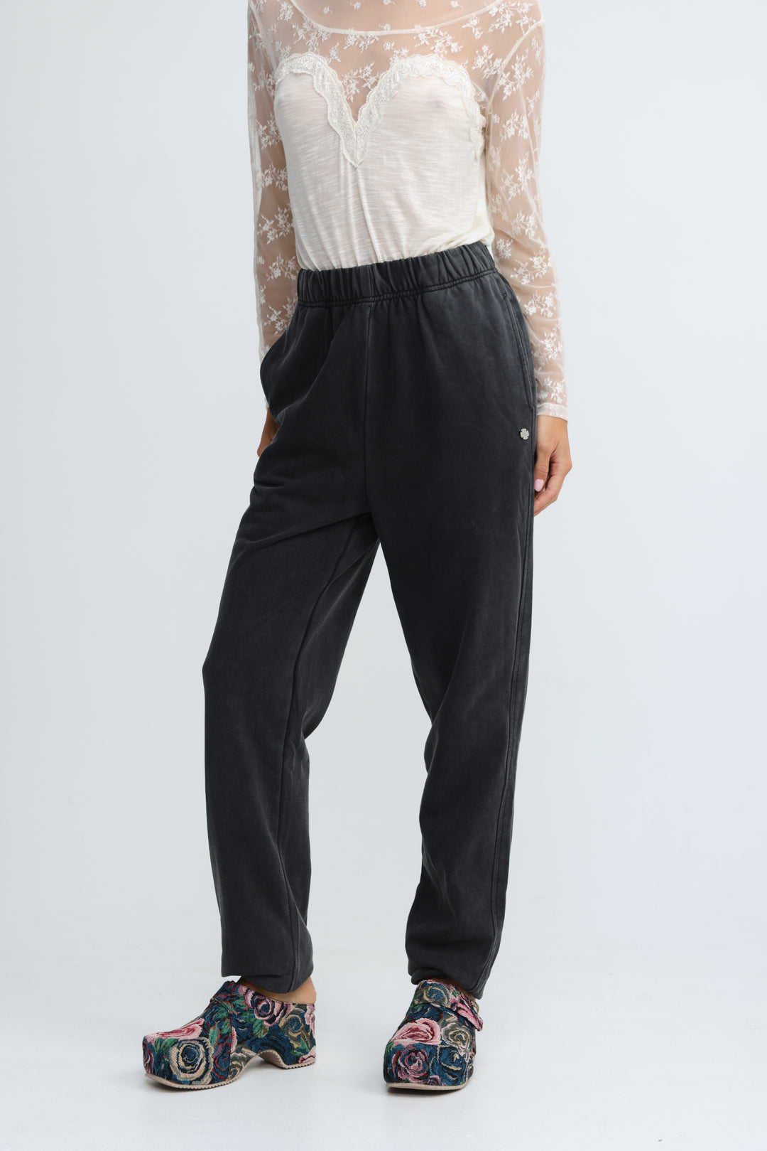 Black high-waisted joggers with soft stretchy fabric and subtle side seam detailing shown from the front