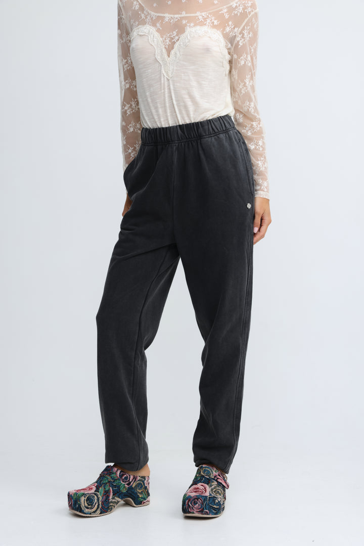 Black high-waisted joggers with soft stretchy fabric and subtle side seam detailing shown from the front