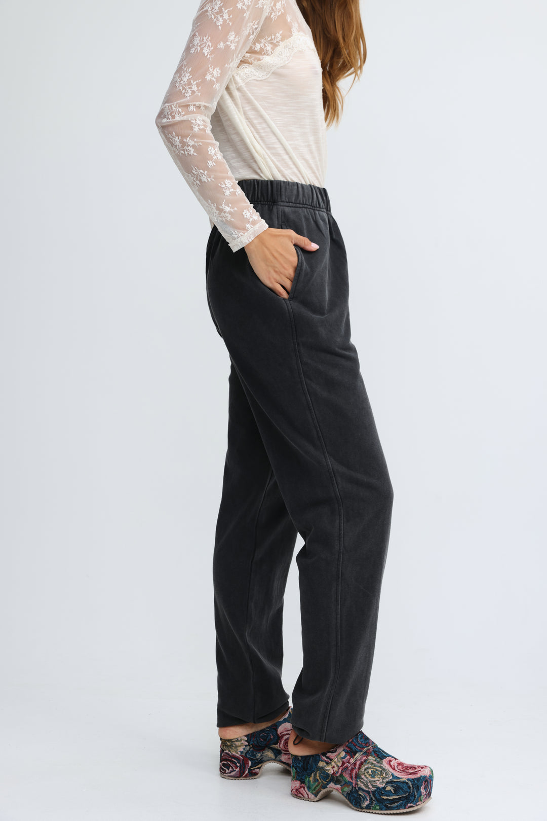Zone black joggers with a black elastic waist, soft textured fabric, and subtle side seam detailing shown from the front
