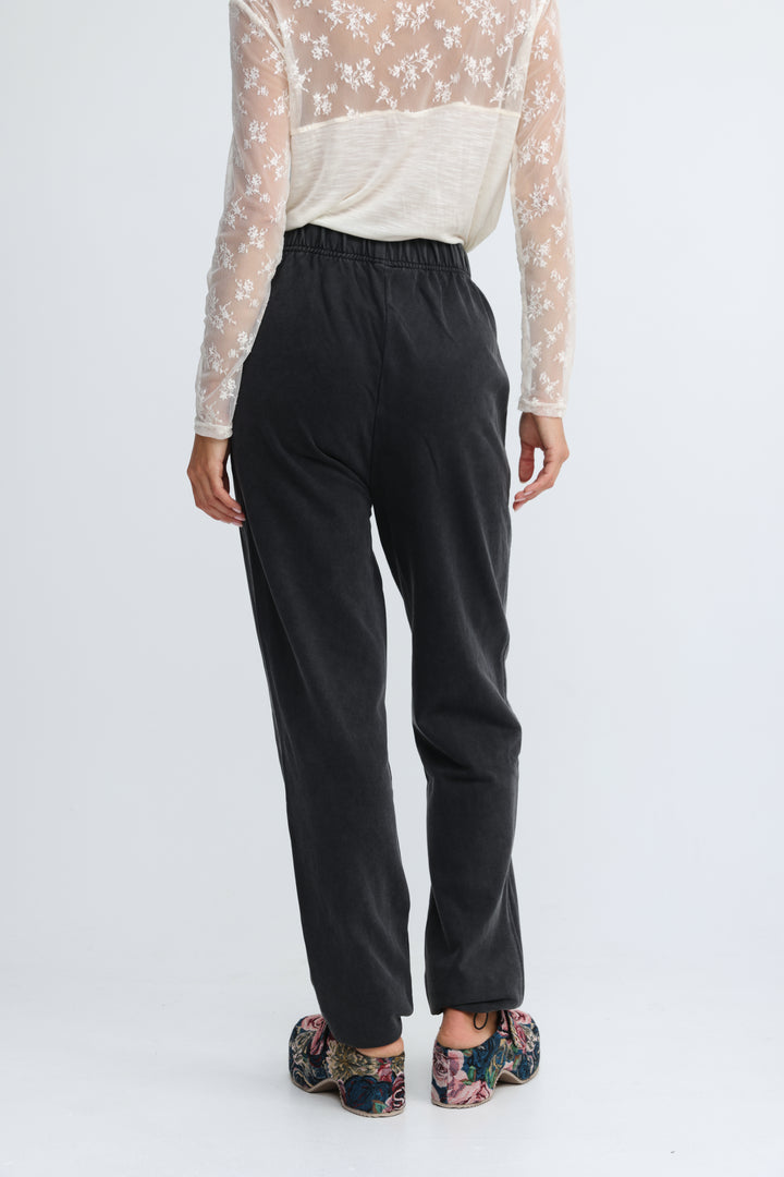 Zone black joggers in black with high-waisted elastic waistband and relaxed straight-leg cut shown from the front