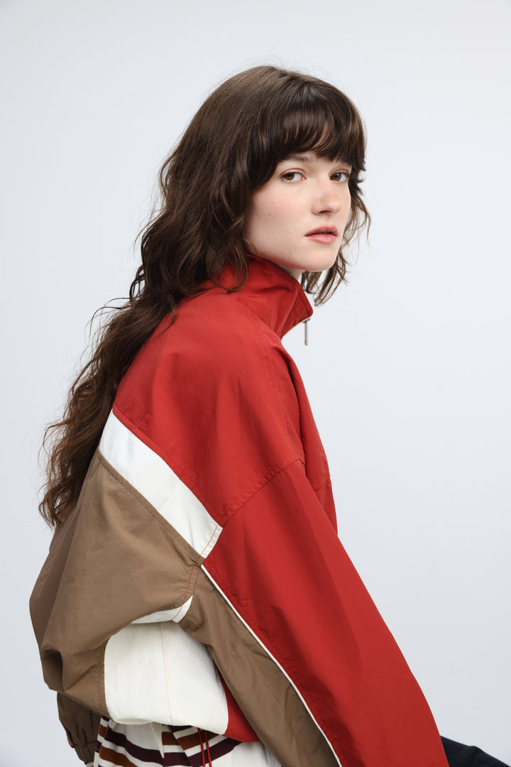 Madas red jacket windbreaker with red beige and white color blocking and a high collar shown from the front