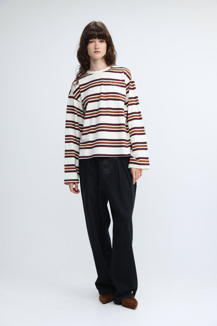A cozy cream long-sleeved sweater with horizontal brown stripes shown from the front