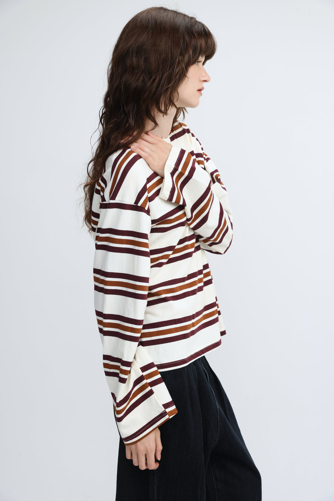 Long-sleeved cream striped shirt with white, maroon, and brown stripes and a relaxed fit shown from the front