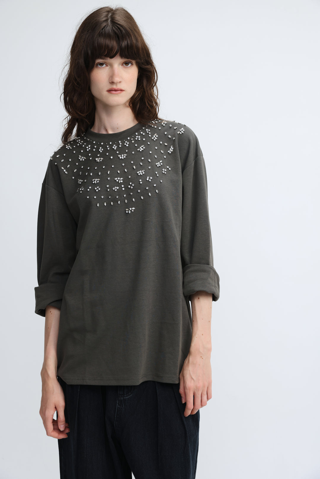 Olive green long-sleeved coco grey shirt with silver stud embellishments across shoulders and chest front view