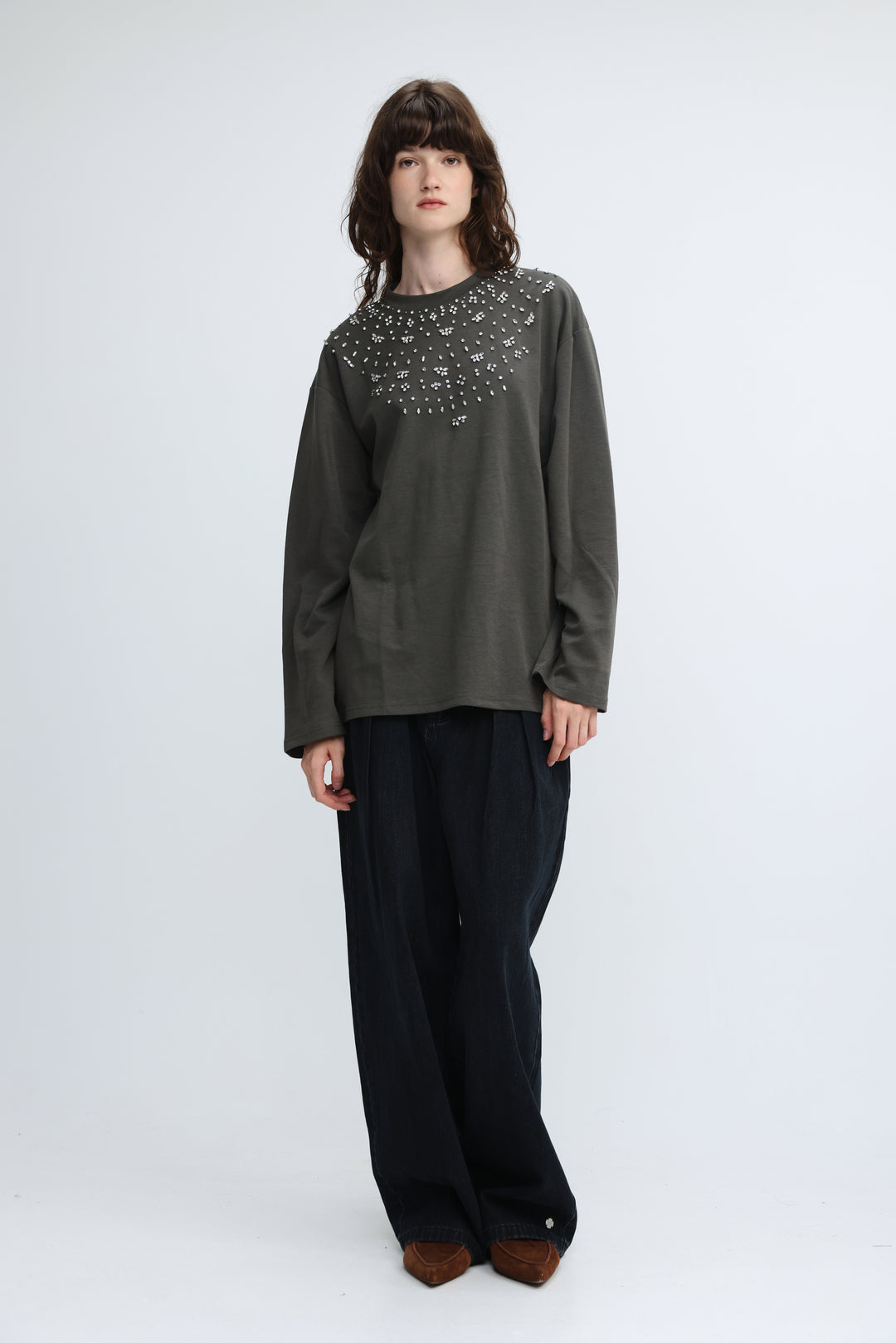 Olive green long-sleeved top with decorative studded neckline shown from the front titled coco grey shirt