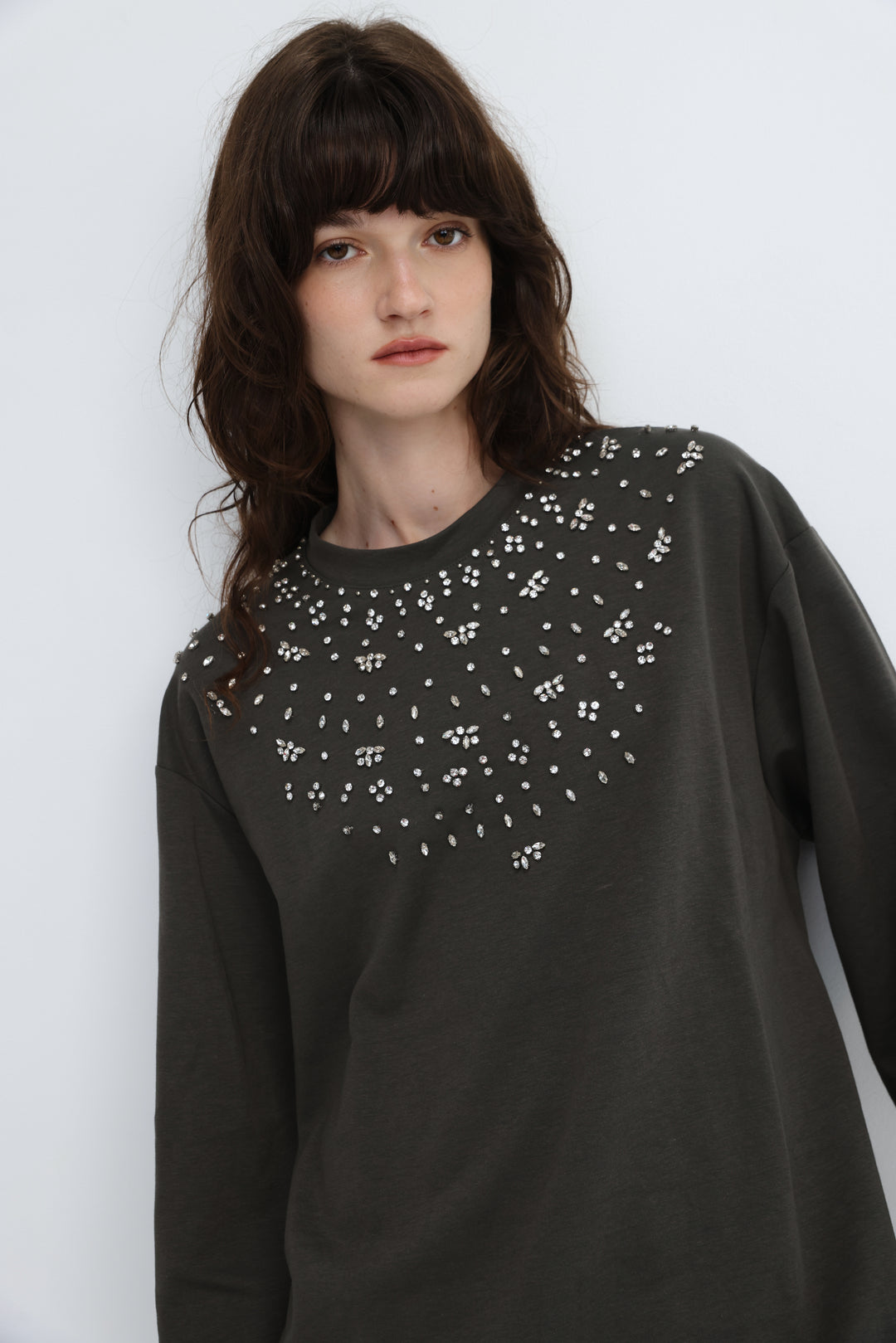 Dark gray long-sleeved coco grey shirt with white rhinestone pattern across the front neckline
