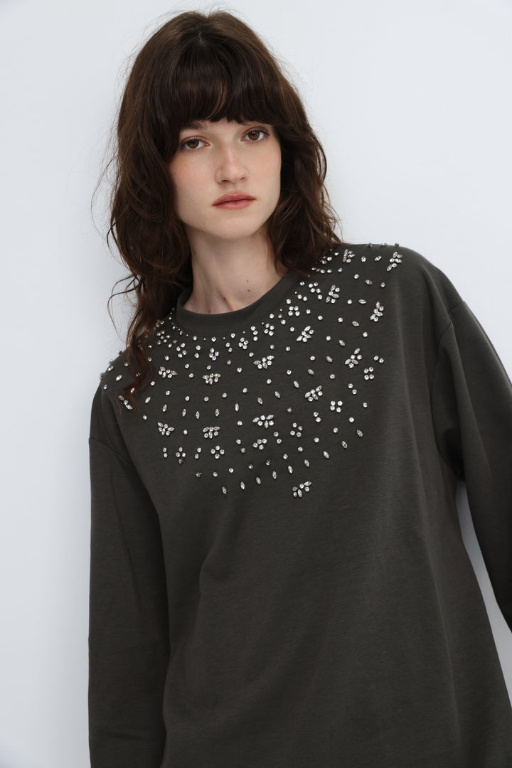 Dark gray long-sleeved coco grey shirt with white rhinestone pattern across the front neckline