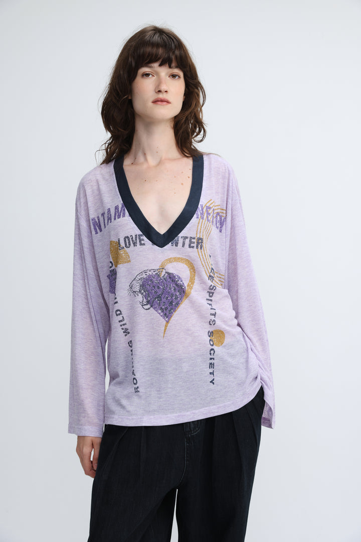 Lavender long-sleeved v-neck jungle purple v shirt with dark blue trim and graphic print of hearts text and gold accents front view