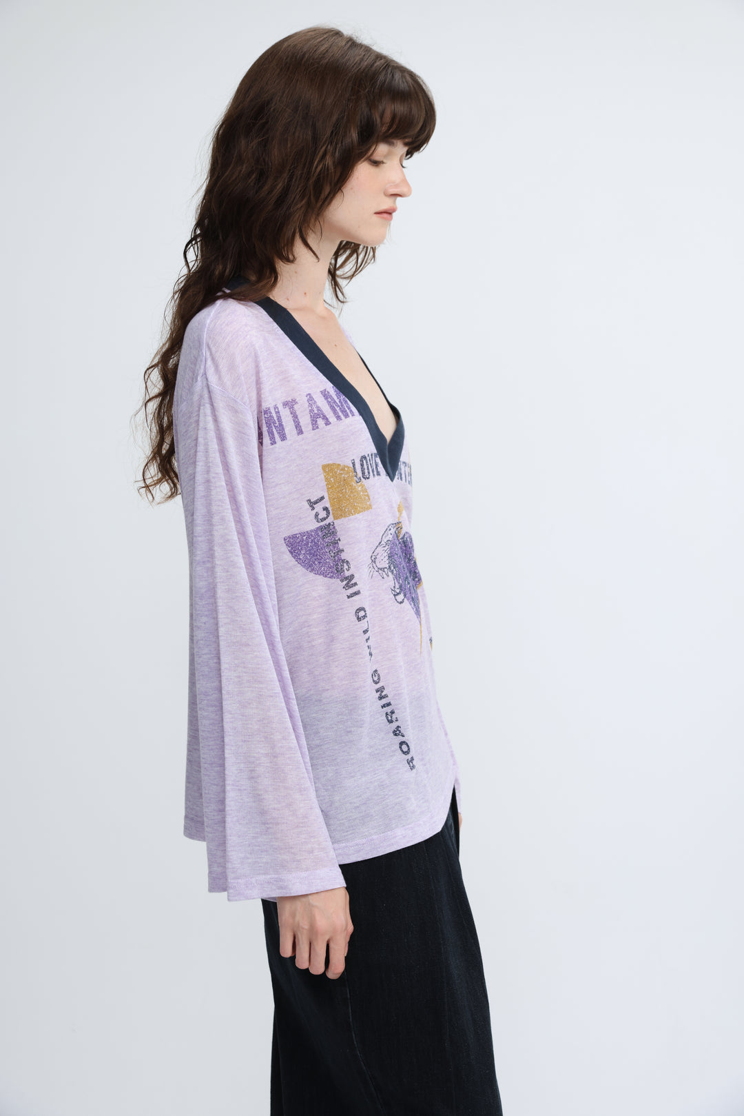 Lavender long-sleeved v-neck jungle purple v shirt with black trim and graphic print with gold foil accents front view