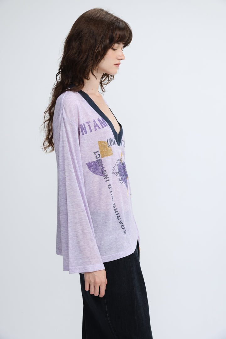 Lavender long-sleeved v-neck jungle purple v shirt with black trim and graphic print with gold foil accents front view