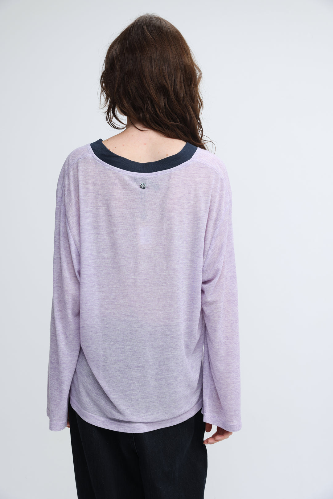 A soft lavender long-sleeved Jungle Purple V shirt with a dark navy ribbed crew neckline shown from the front