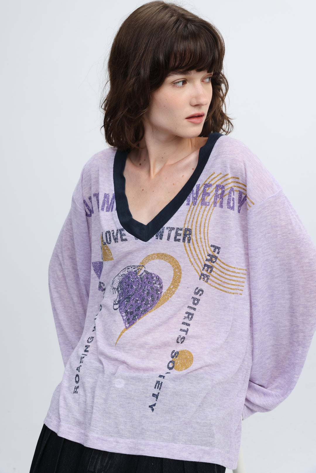 Jungle purple v shirt front showing a lavender long-sleeved top with navy v-neckline and gold glitter free spirits society text