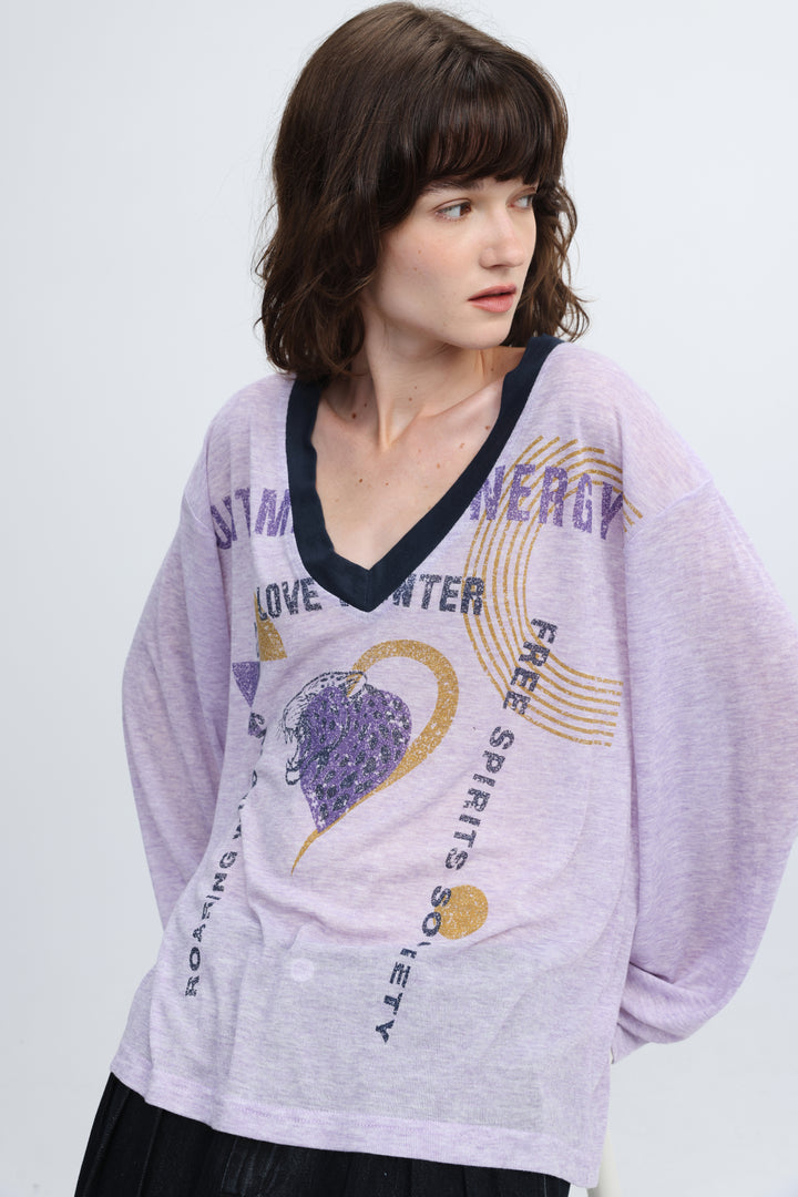 Jungle purple v shirt front showing a lavender long-sleeved top with navy v-neckline and gold glitter free spirits society text