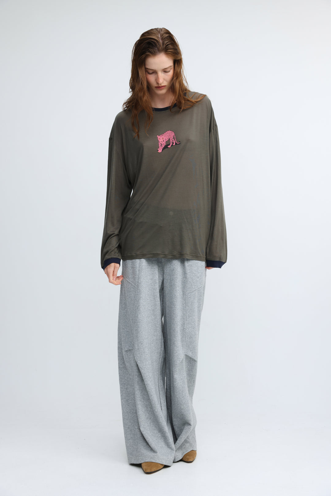Olive green long-sleeved top with pink embroidered tiger on chest and navy blue trim at neckline and cuffs