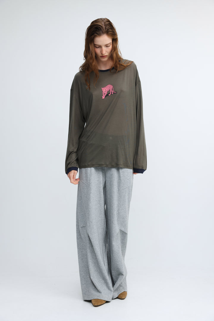 Olive green long-sleeved top with pink embroidered tiger on chest and navy blue trim at neckline and cuffs
