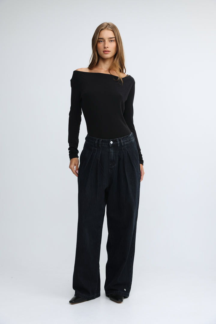 Black off-the-shoulder long-sleeve top with fitted bodice and slightly flared sleeves shown from the front