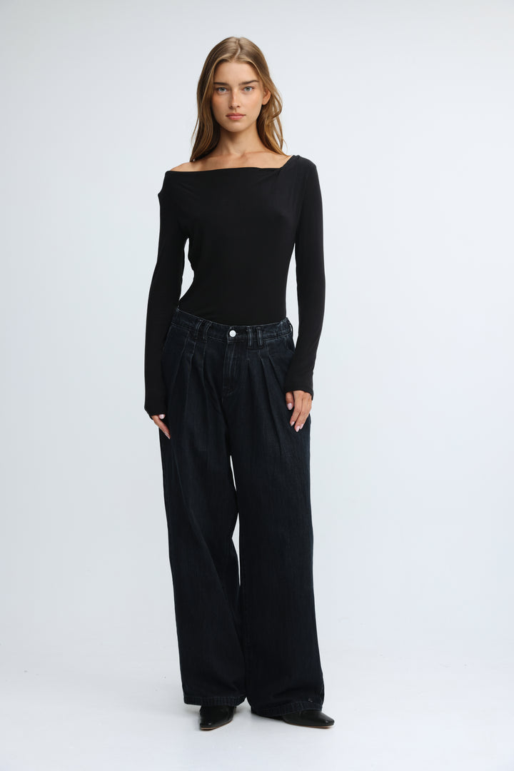 Black off-the-shoulder long-sleeve top with sleek form-fitting silhouette shown from the front