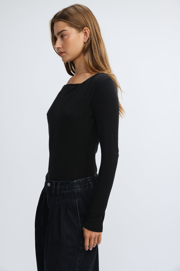 Black long-sleeved top with square neckline shown from the front in the product titled Miss Black Shirt