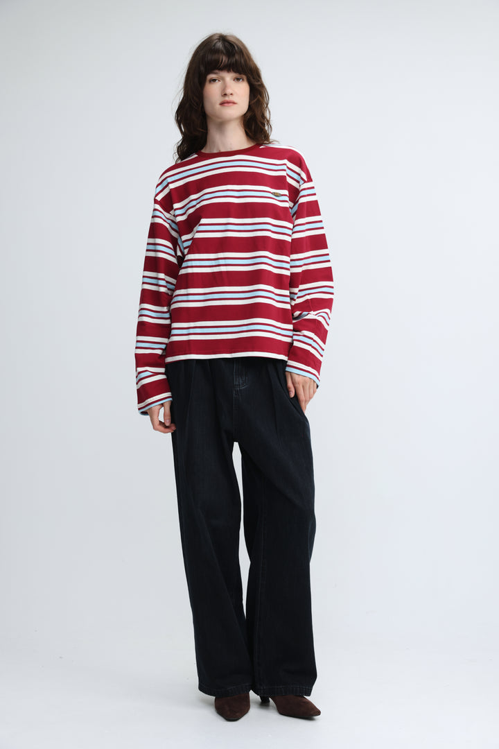 Red and white horizontally striped long-sleeved sweater with round neckline shown from the front