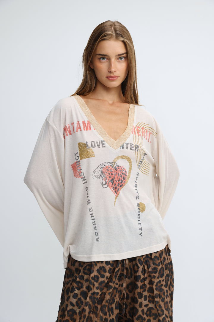 Cream-colored oversized graphic v-neck tee with bold text and a pink leopard print heart on the front