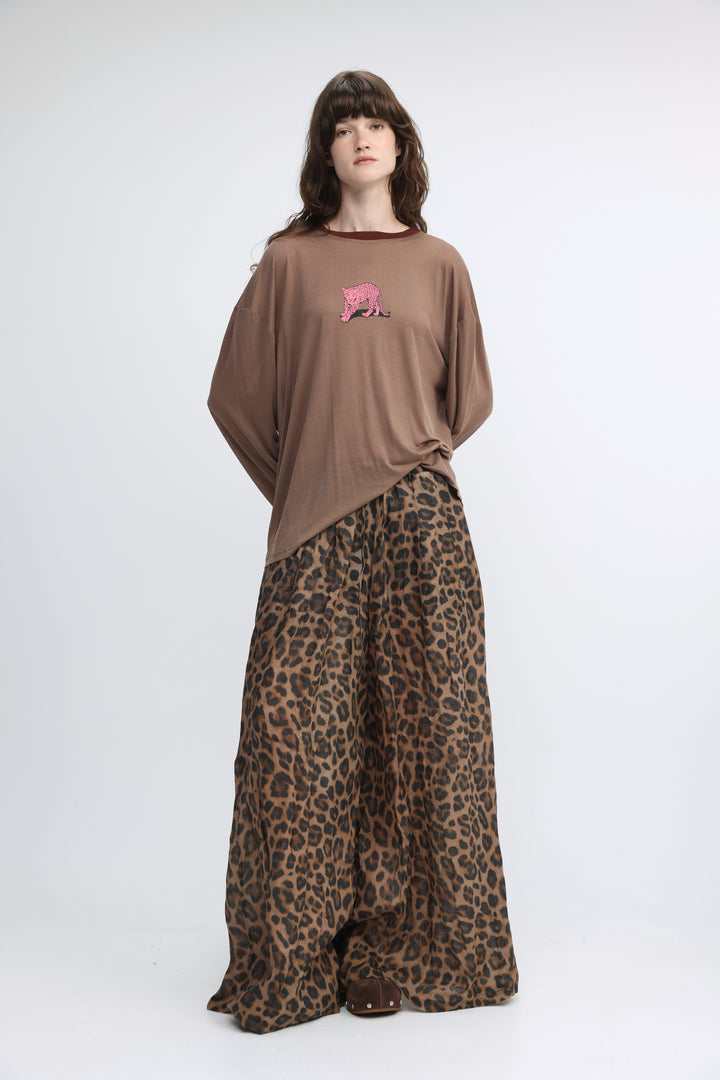 Brown oversized t-shirt with a pink embroidered tiger on the chest shown from the front