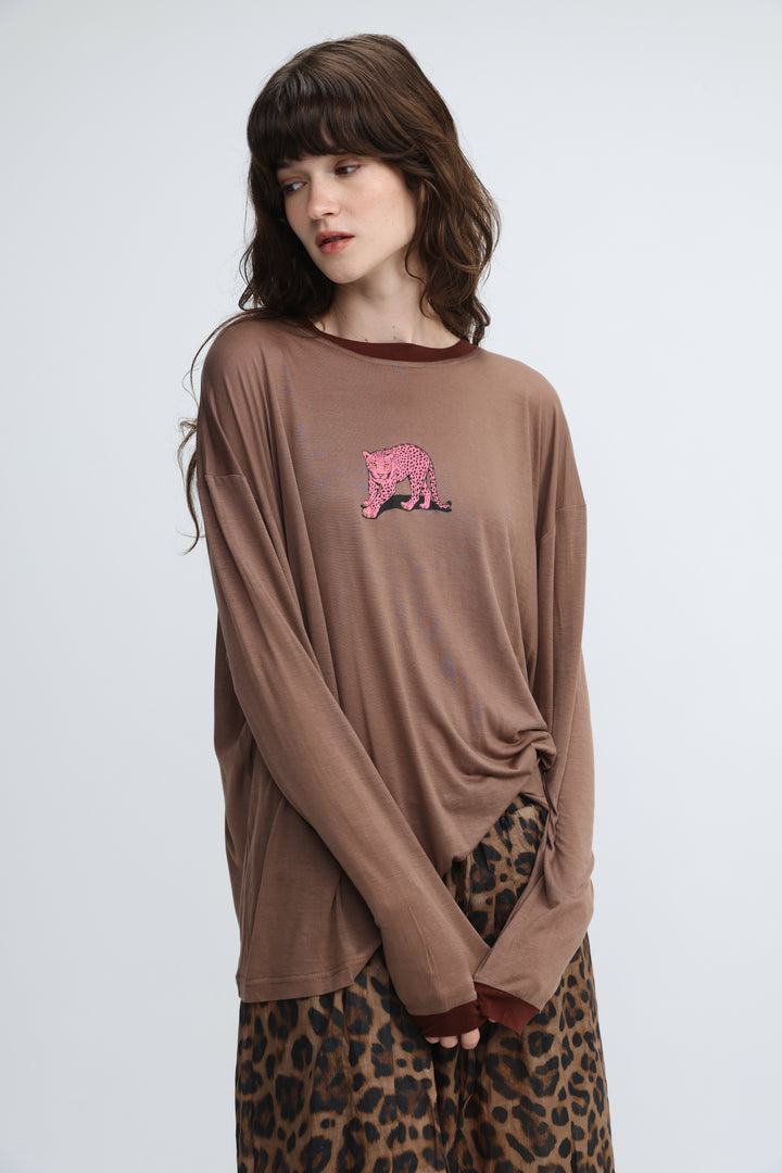 Brown long-sleeved shirt with pink leopard embroidery on the chest and matching brown trim on neckline and cuffs