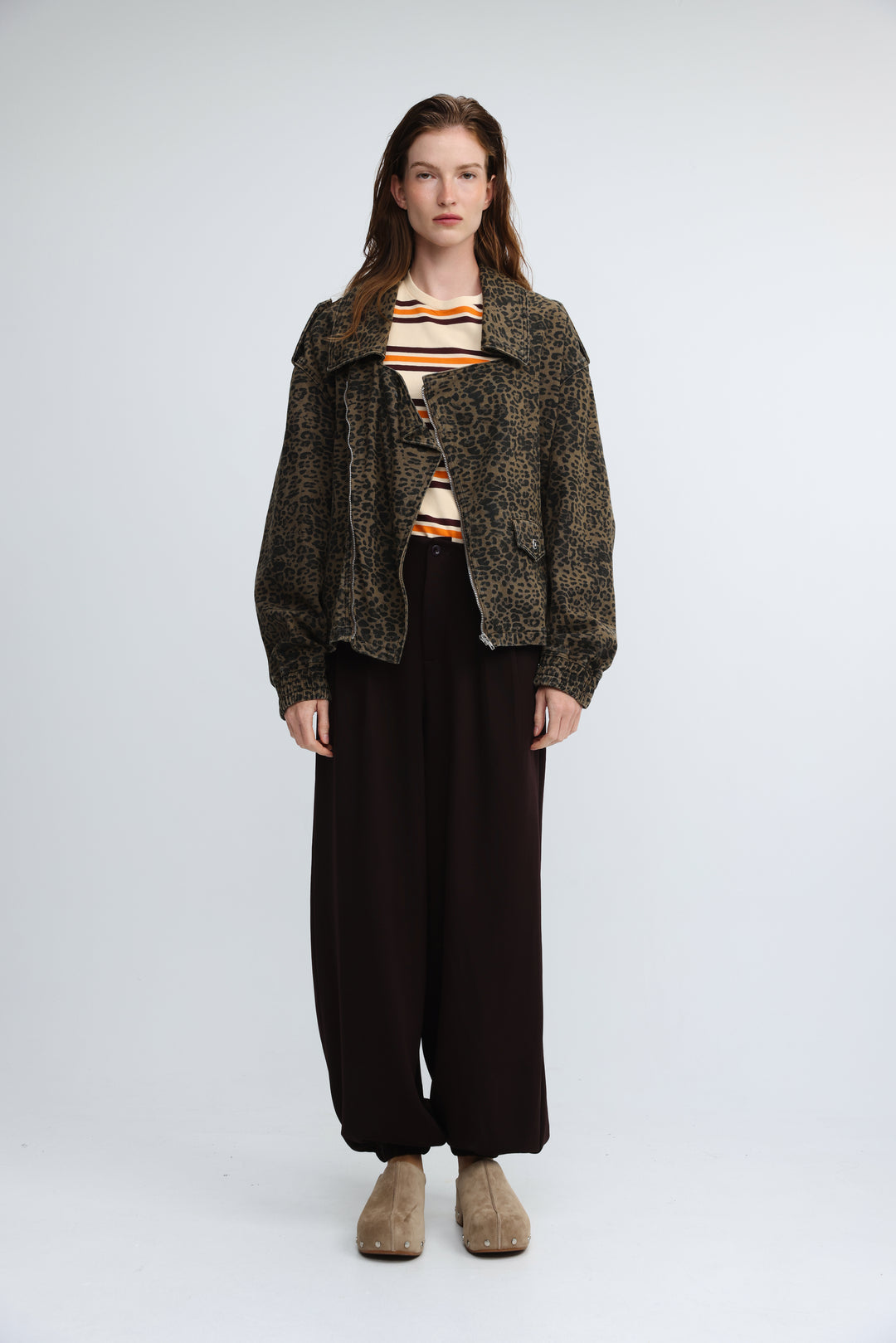 Dark olive green leopard print jacket with oversized fit and frayed hem shown from the front