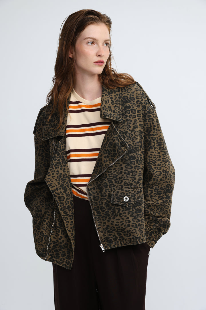 Olive green leopard-print denim moto jacket with front silver zipper and button details visible from the front