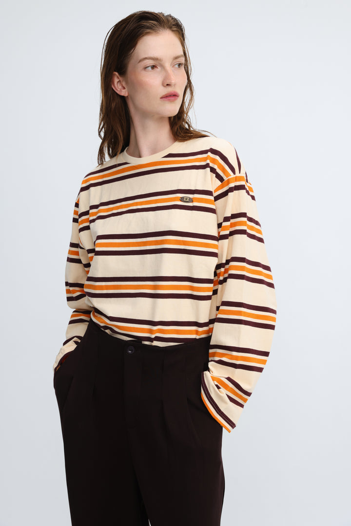 Cream-colored long-sleeved Federer orange striped shirt with bold orange and dark brown horizontal stripes and green logo patch front