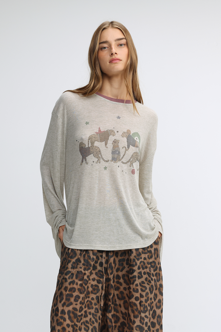 Jungle grey shirt long-sleeved top with a whimsical print of stylized animals and stars in earth tones front view